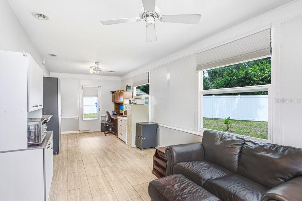 1632 Heather Place Palm Harbor, FL 34684 - Photo 34 of 53 a living room with furniture and a large window