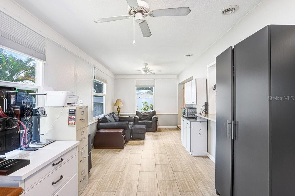 1632 Heather Place Palm Harbor, FL 34684 - Photo 37 of 53 a living room with stainless steel appliances furniture a fireplace and a window