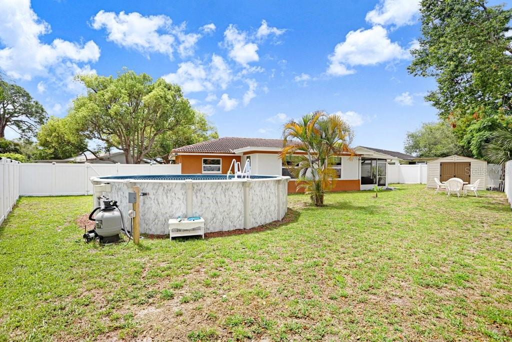 1632 Heather Place Palm Harbor, FL 34684 - Photo 48 of 53 a front view of a house with garden