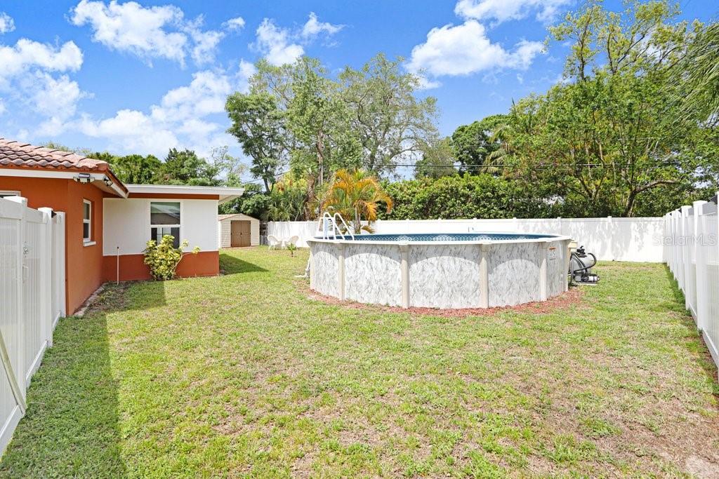 1632 Heather Place Palm Harbor, FL 34684 - Photo 49 of 53 a view of a backyard with large tree