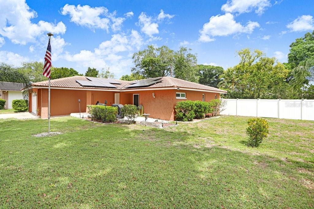 1632 Heather Place Palm Harbor, FL 34684 - Photo 7 of 53 a view of a back yard of the house