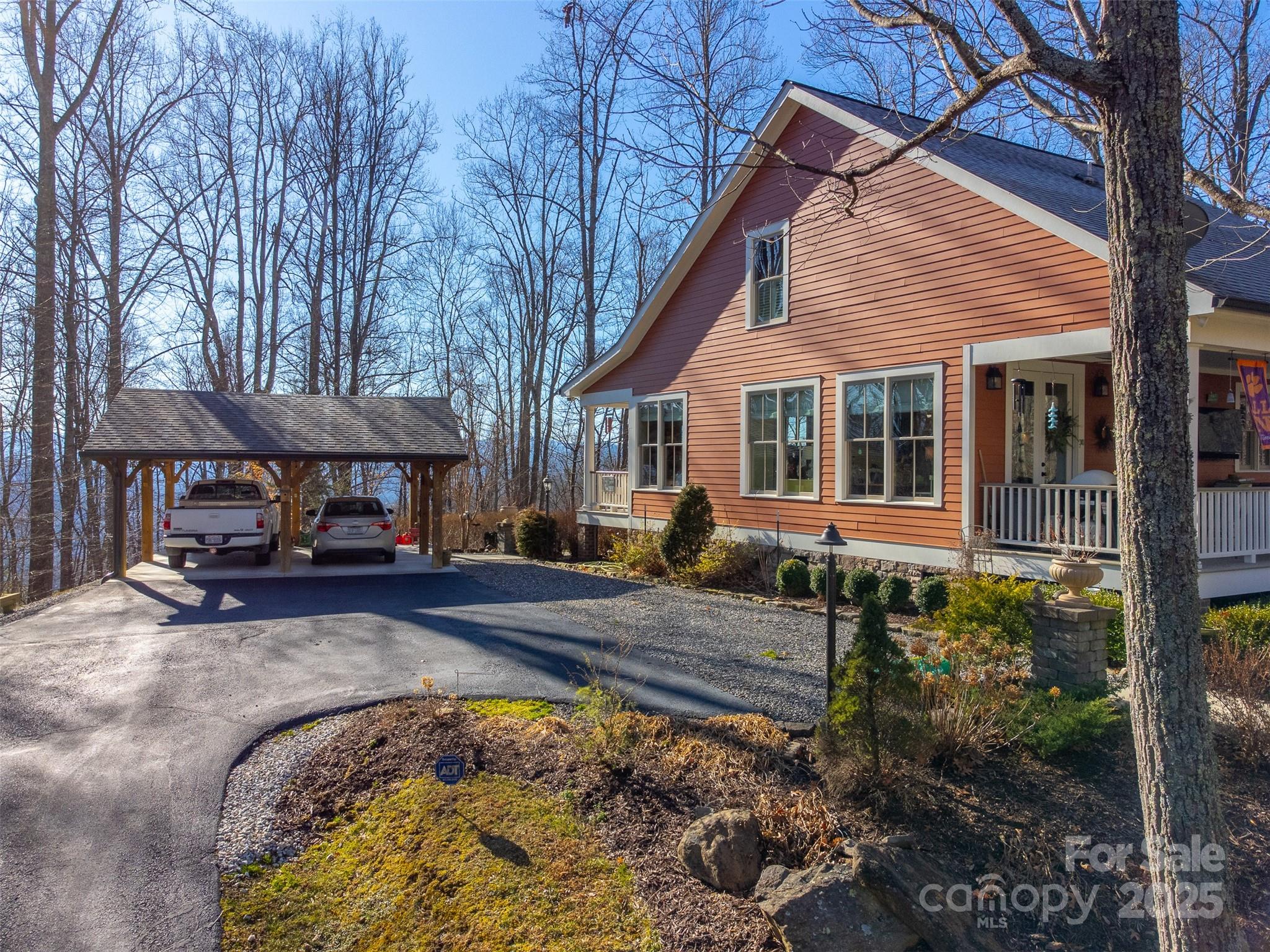 1226 Monteith Branch Road Sylva, NC 28779 - Photo 1 of 40 a view of a house with a yard and sitting area