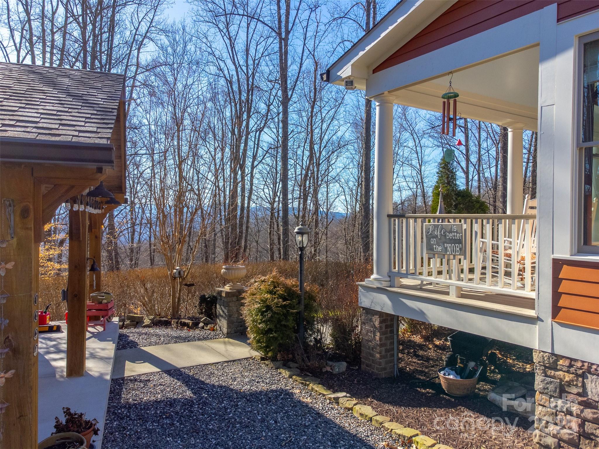 1226 Monteith Branch Road Sylva, NC 28779 - Photo 11 of 40 a view of a porch with furniture and next to a yard