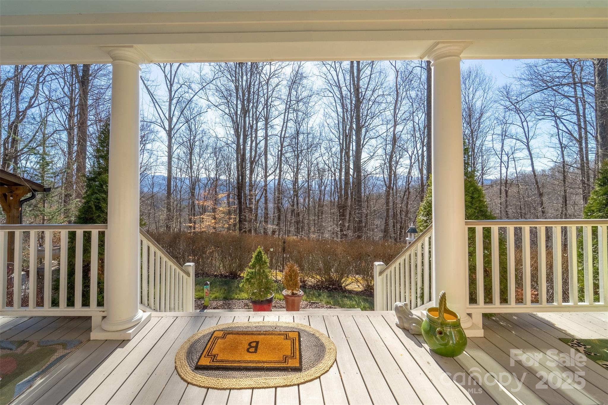 1226 Monteith Branch Road Sylva, NC 28779 - Photo 17 of 40 a view of a balcony with chairs and wooden floor