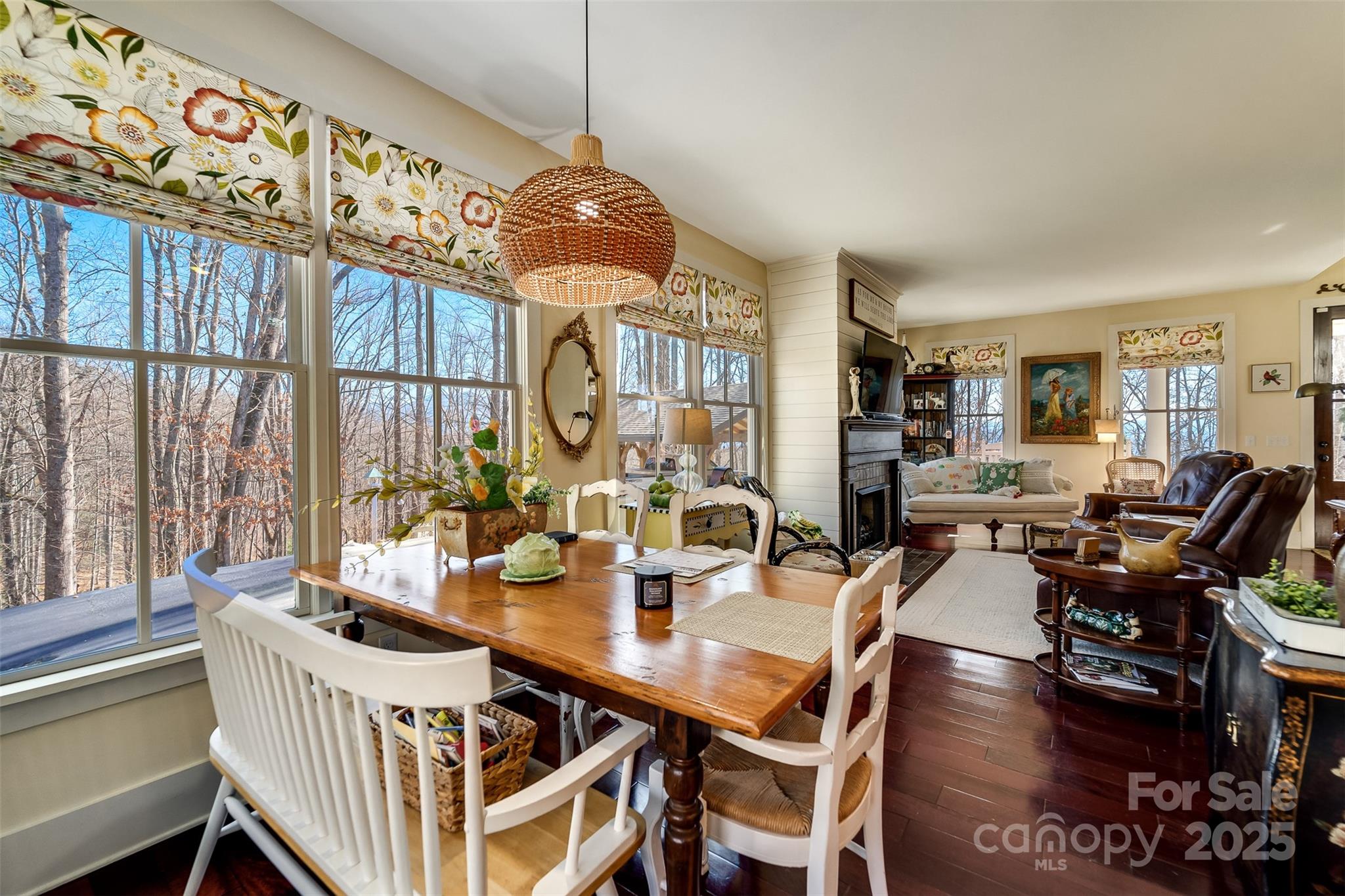 1226 Monteith Branch Road Sylva, NC 28779 - Photo 22 of 40 a view of a dining room with furniture wooden floor and chandelier