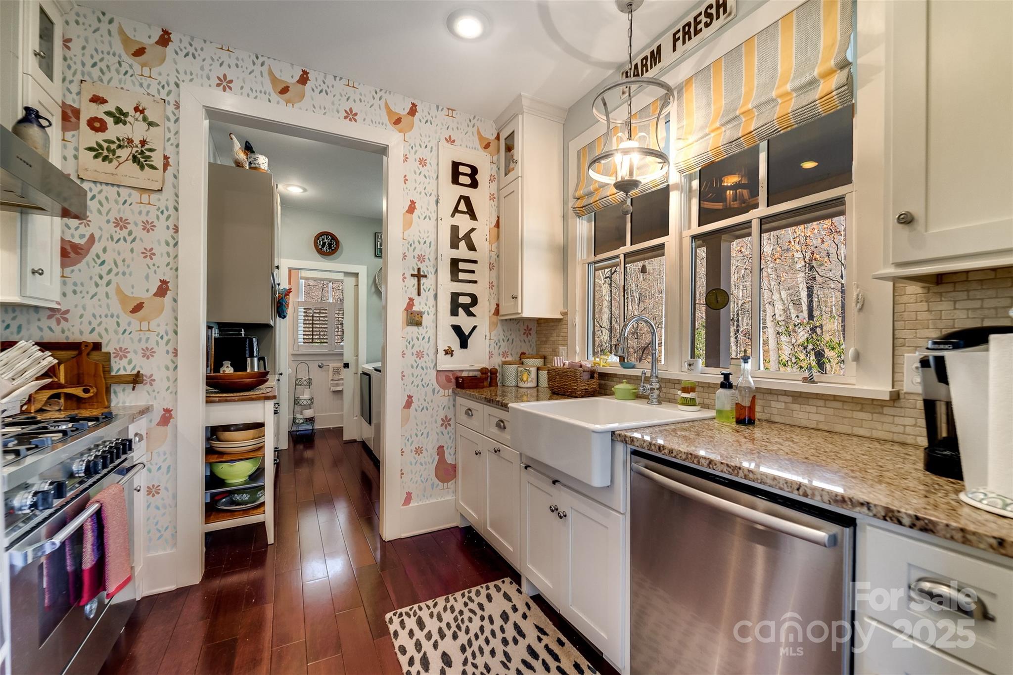1226 Monteith Branch Road Sylva, NC 28779 - Photo 23 of 40 a kitchen with a sink stove and cabinets