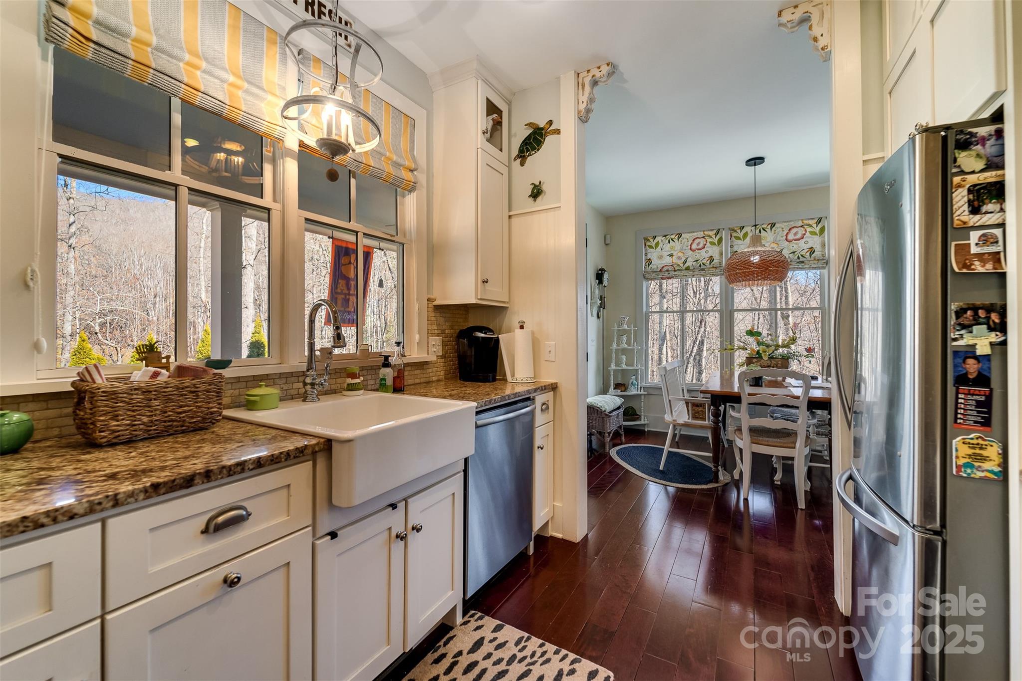 1226 Monteith Branch Road Sylva, NC 28779 - Photo 26 of 40 a kitchen with lots of counter top space and wooden floor