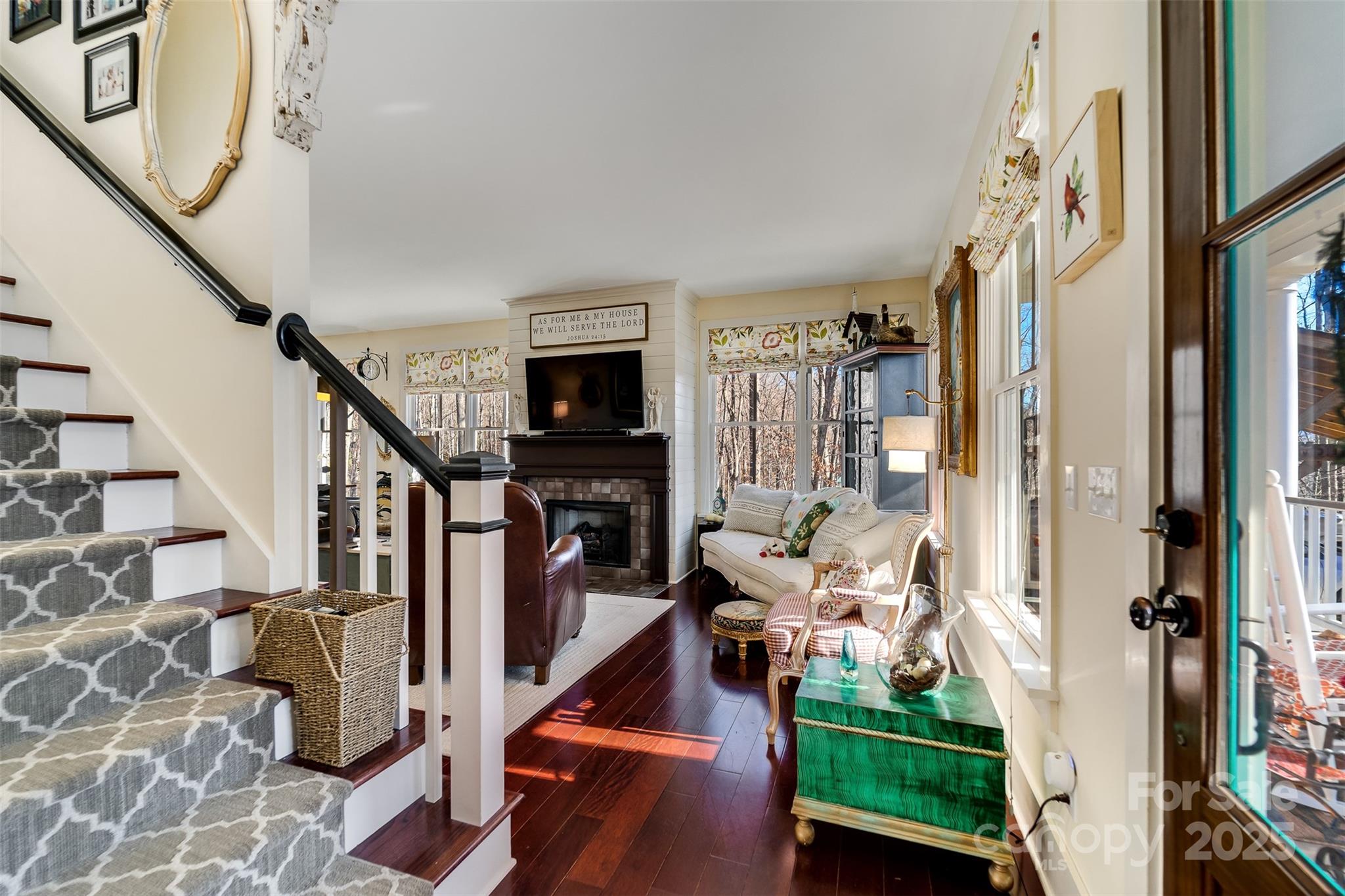 1226 Monteith Branch Road Sylva, NC 28779 - Photo 31 of 40 a room with lots of white furniture and wooden floor