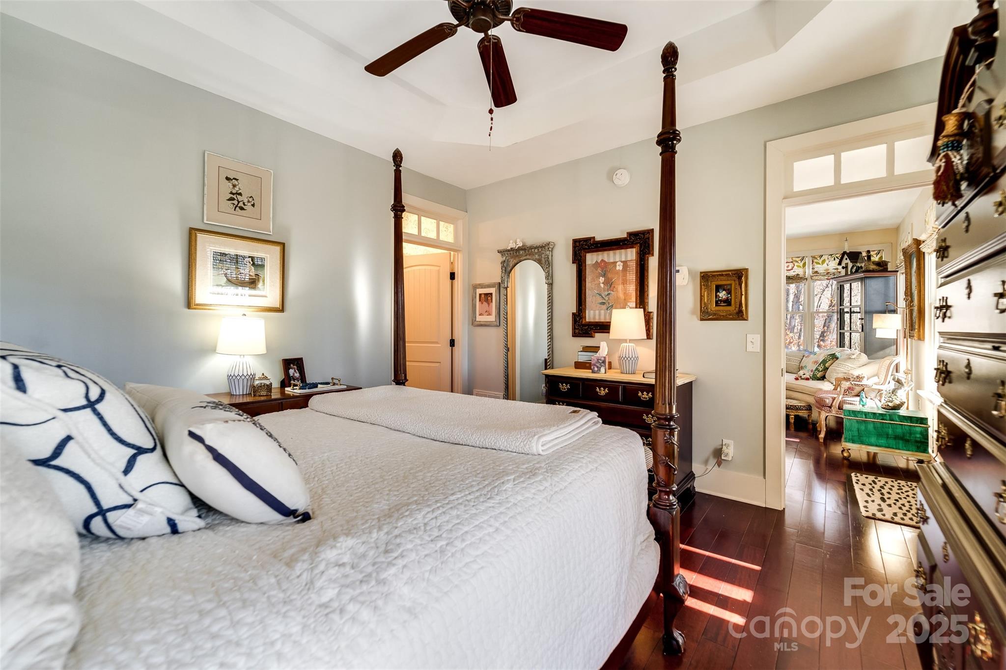 1226 Monteith Branch Road Sylva, NC 28779 - Photo 33 of 40 a bedroom with a bed and wooden floor