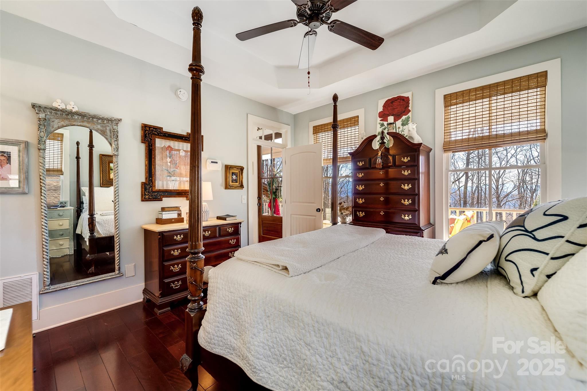 1226 Monteith Branch Road Sylva, NC 28779 - Photo 34 of 40 a bedroom with a bed a dresser and a large window
