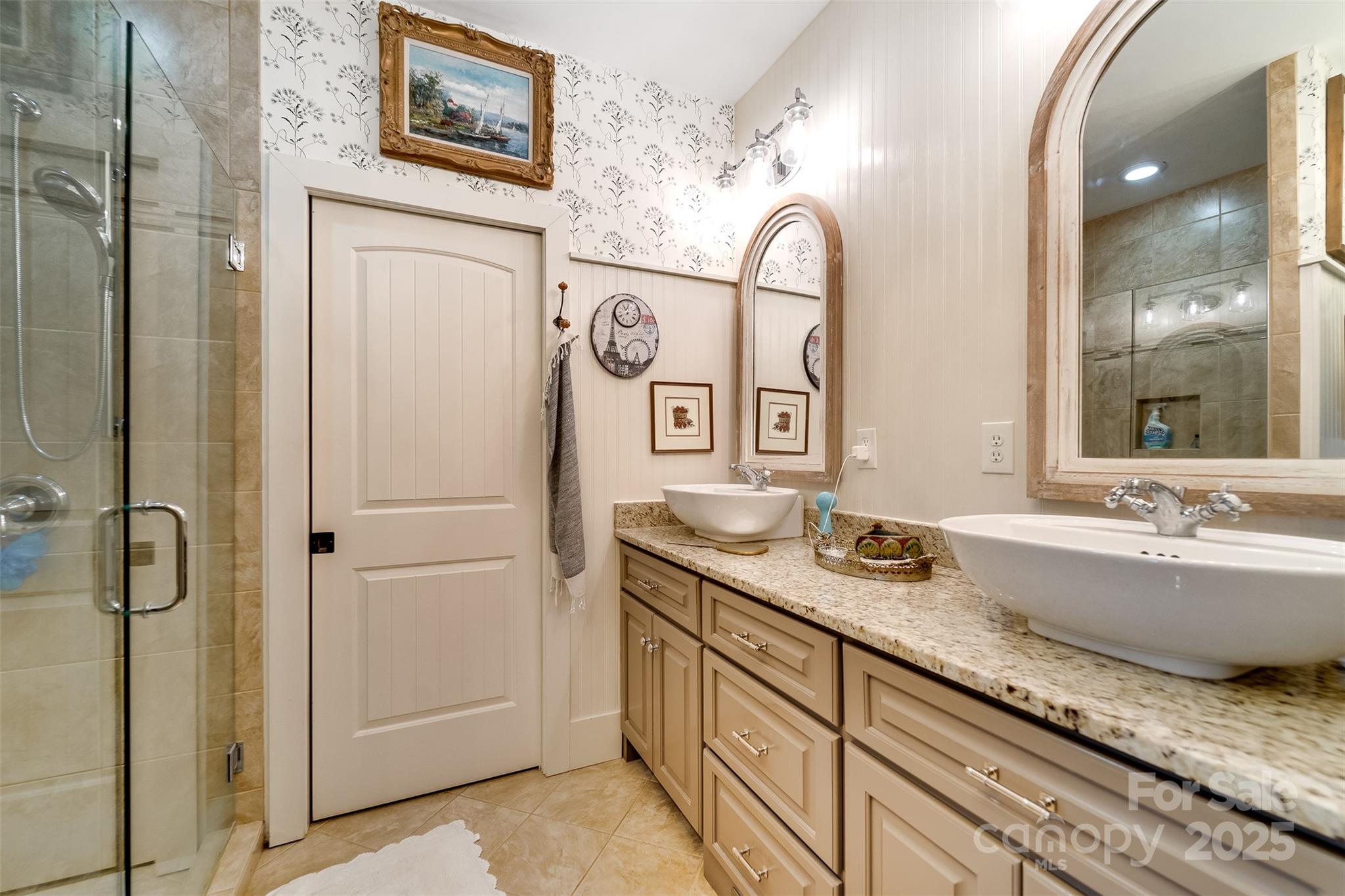 1226 Monteith Branch Road Sylva, NC 28779 - Photo 36 of 40 a bathroom with a granite countertop tub sink and mirror