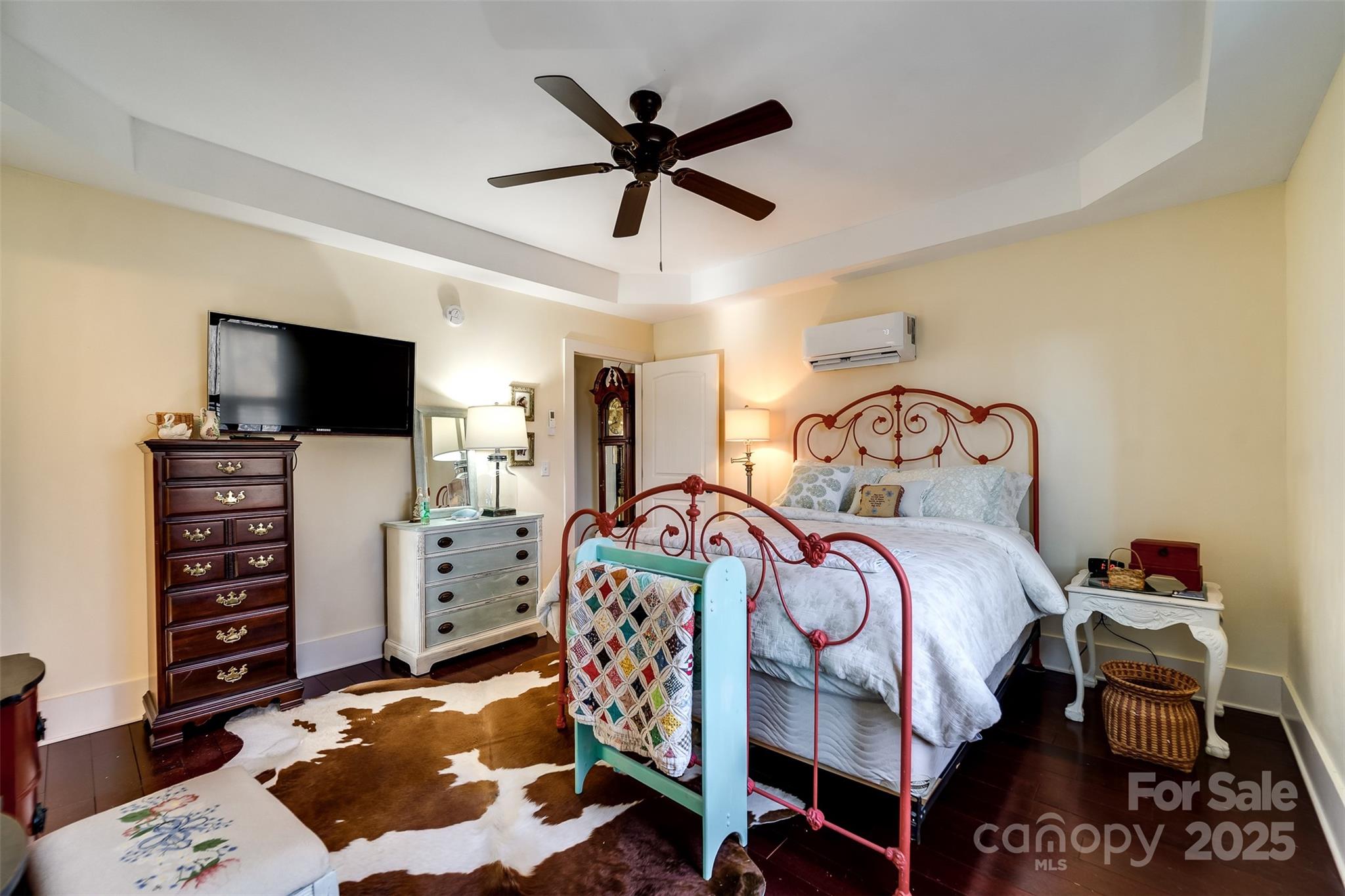 1226 Monteith Branch Road Sylva, NC 28779 - Photo 37 of 40 a bedroom with furniture and a flat screen tv