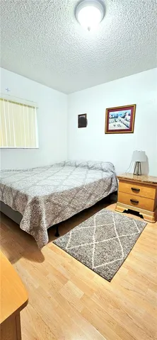 a bedroom with a bed and a cabinets