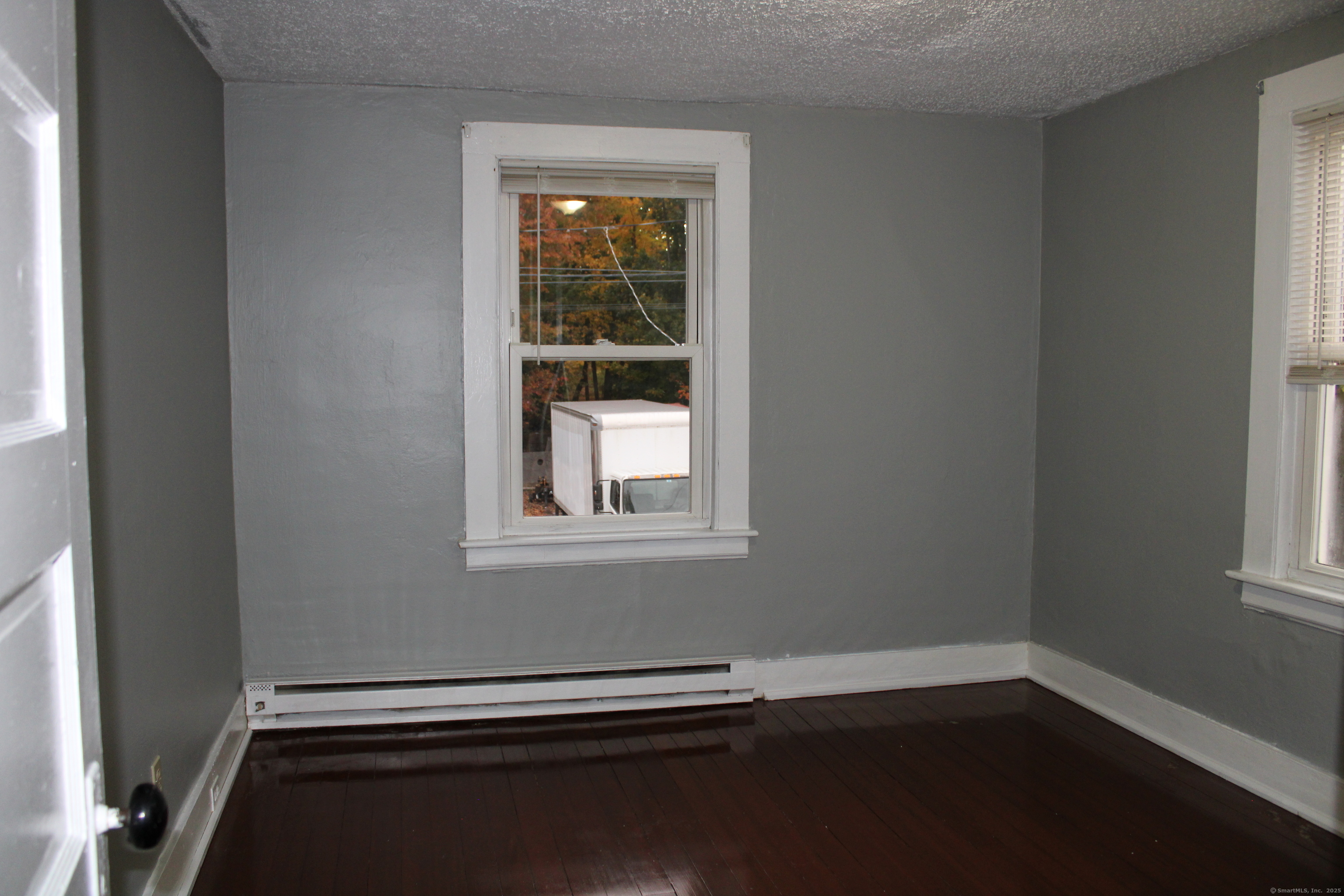 24 James Street Bristol, CT 06010 - Photo 11 of 12 a view of a livingroom with wooden floor and a window