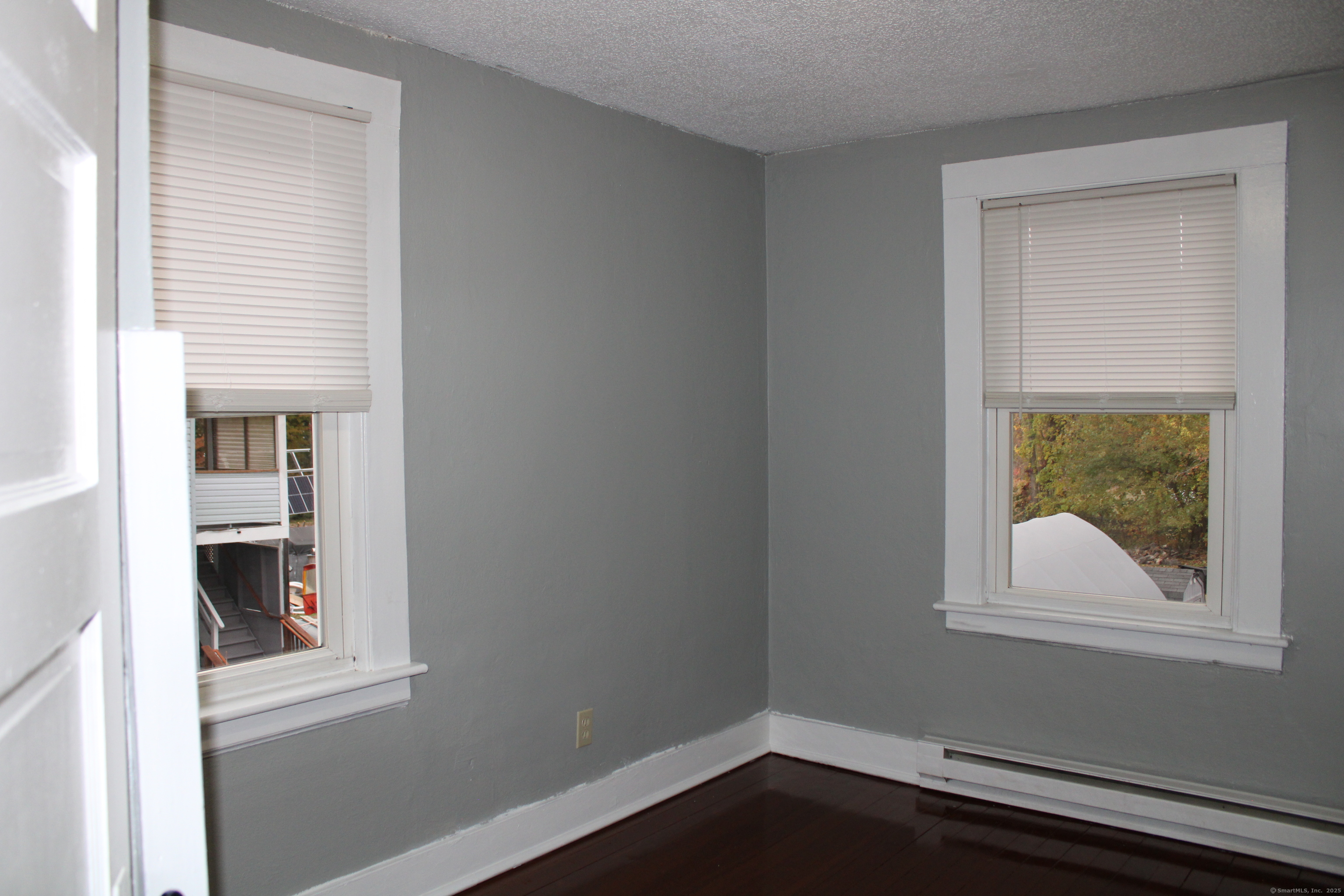 24 James Street Bristol, CT 06010 - Photo 12 of 12 a view of a small space with wooden floor and a window