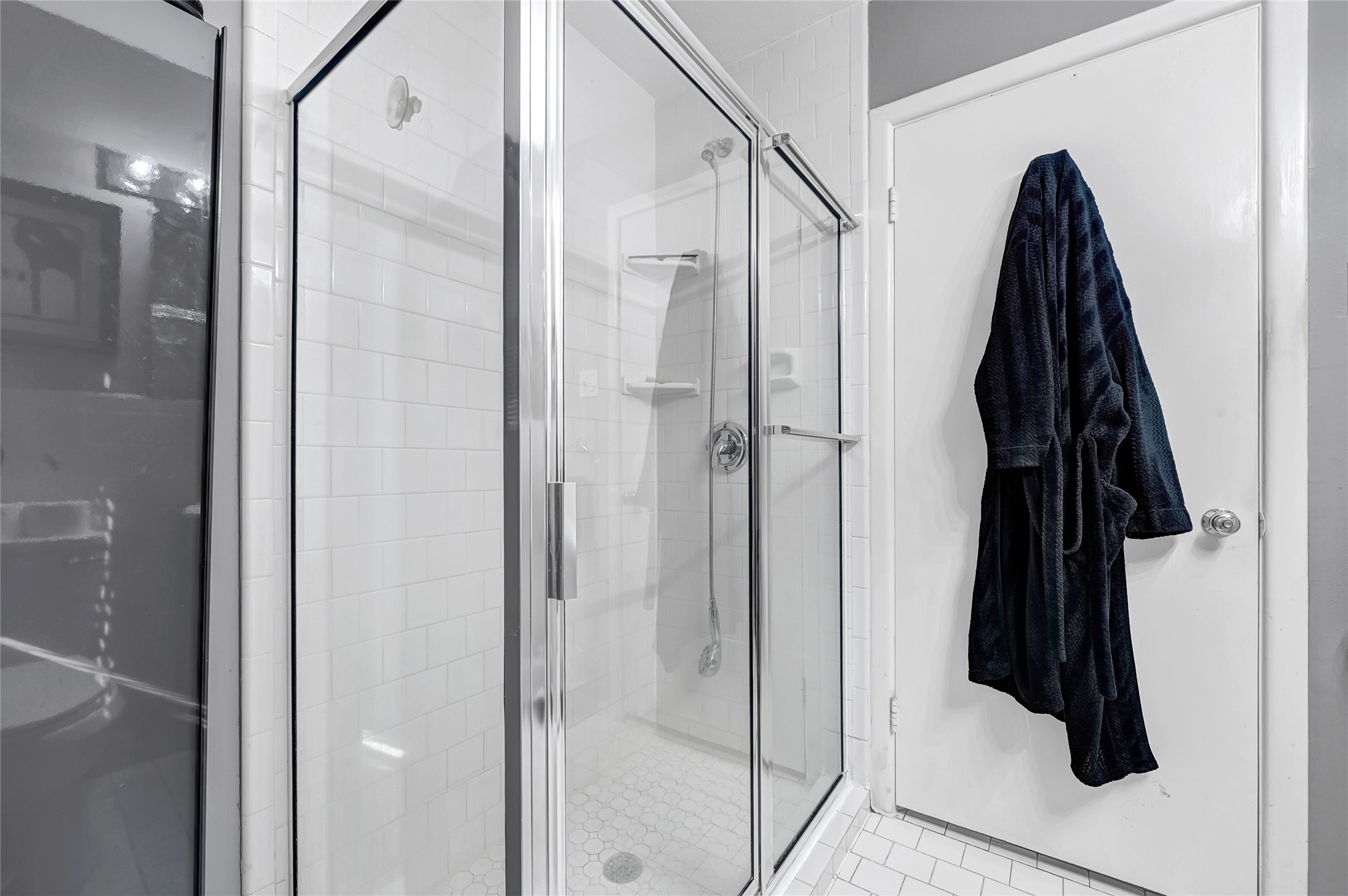 4831 Knickerbocker Street Houston, TX 77035 - Photo 37 of 50 Large, bright shower stall showing a full glass enclosure and overhead lighting.