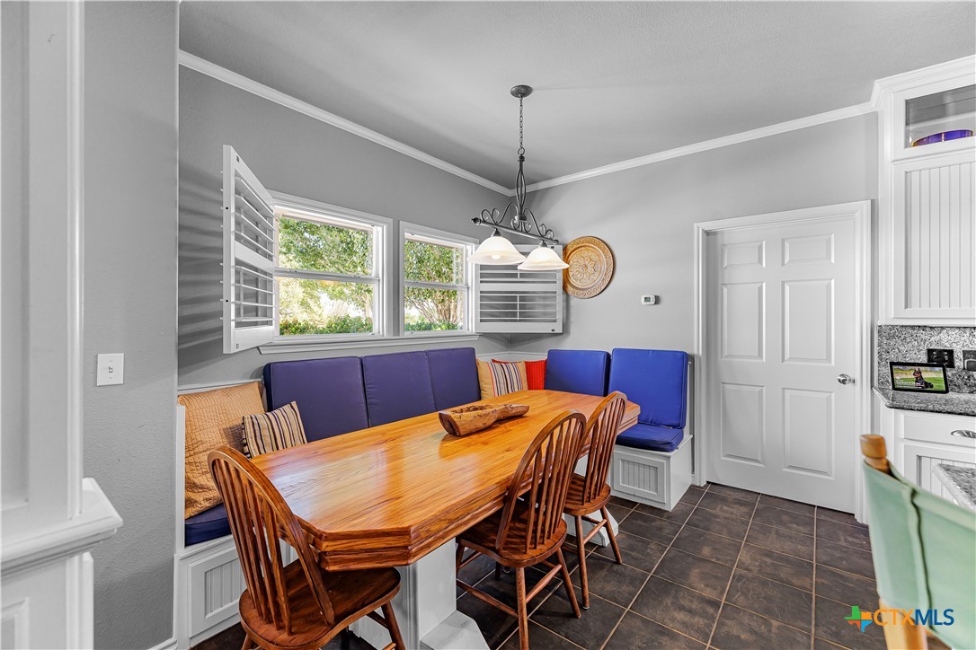 3052 Charco Road Nordheim, TX 78141 - Photo 18 of 43 a view of a dining room with furniture window and wooden floor