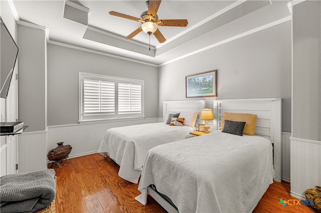 3052 Charco Road Nordheim, TX 78141 - Photo 27 of 43 a bedroom with a bed and a chandelier