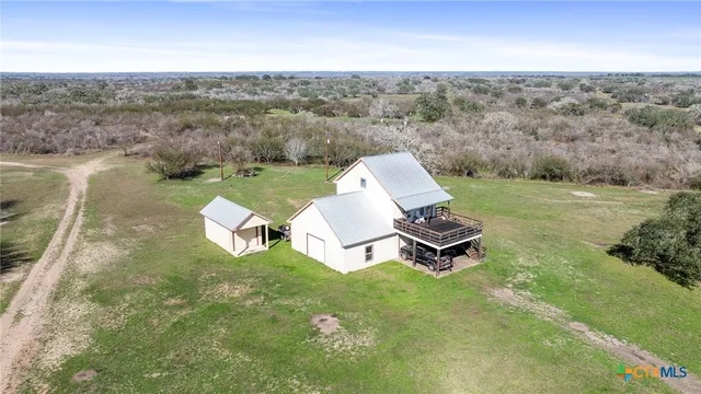 a view of a chairs and tables in a patio