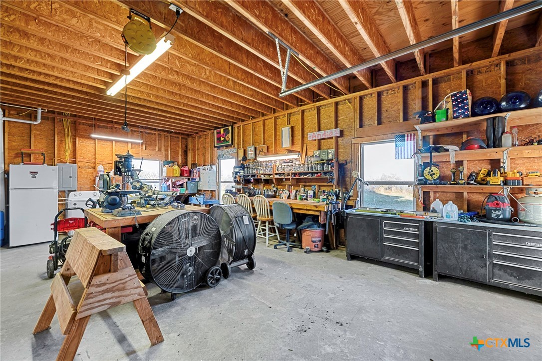 3052 Charco Road Nordheim, TX 78141 - Photo 34 of 43 a storage room with washer and dryer