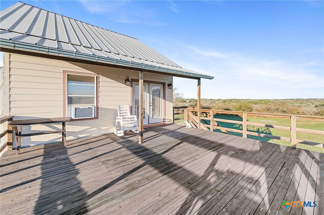 3052 Charco Road Nordheim, TX 78141 - Photo 38 of 43 a view of a balcony with wooden floor and outdoor space