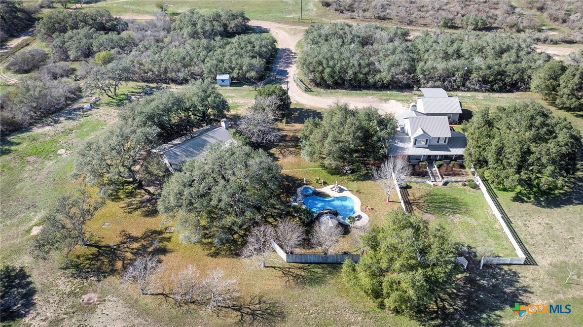 3052 Charco Road Nordheim, TX 78141 - Photo 4 of 43 an aerial view of a house with a yard and lake view