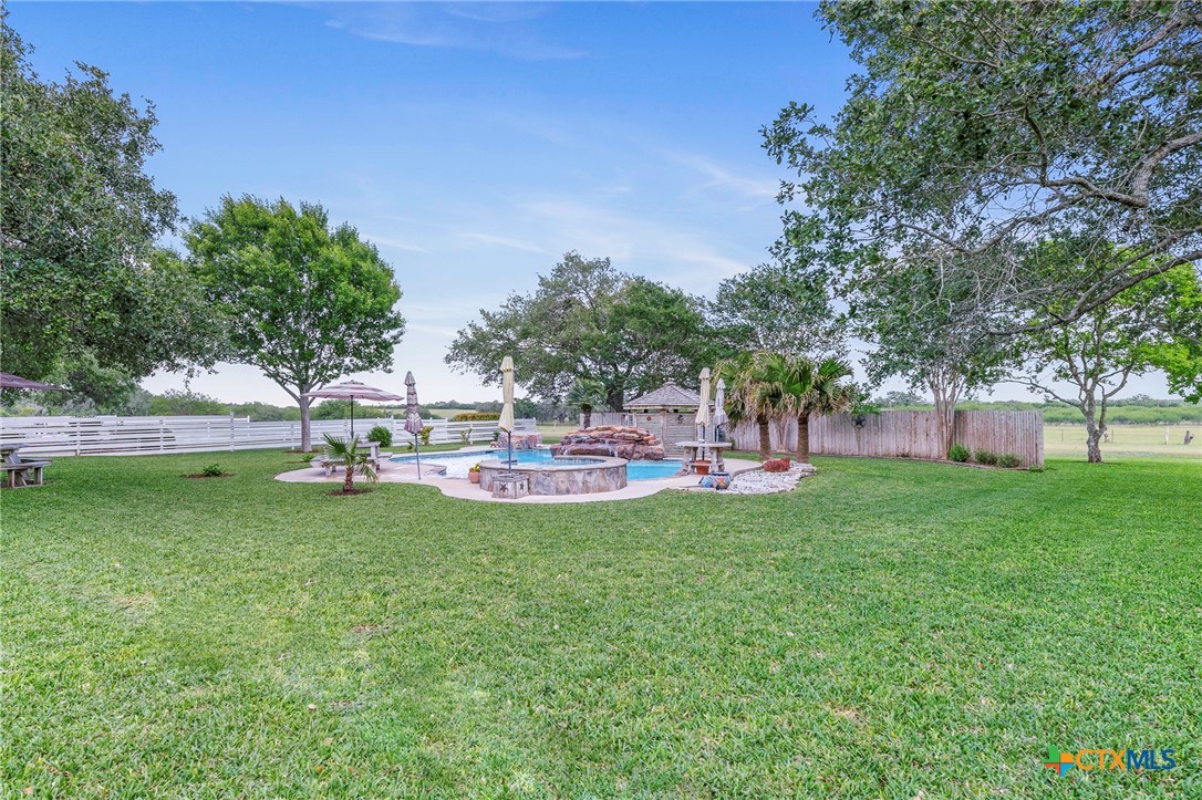 3052 Charco Road Nordheim, TX 78141 - Photo 8 of 43 a view of a garden with trees