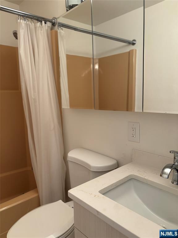 344 Prospect Avenue, Unit 9G Hackensack, NJ 07601 - Photo 14 of 16 a white toilet sitting next to a bath tub