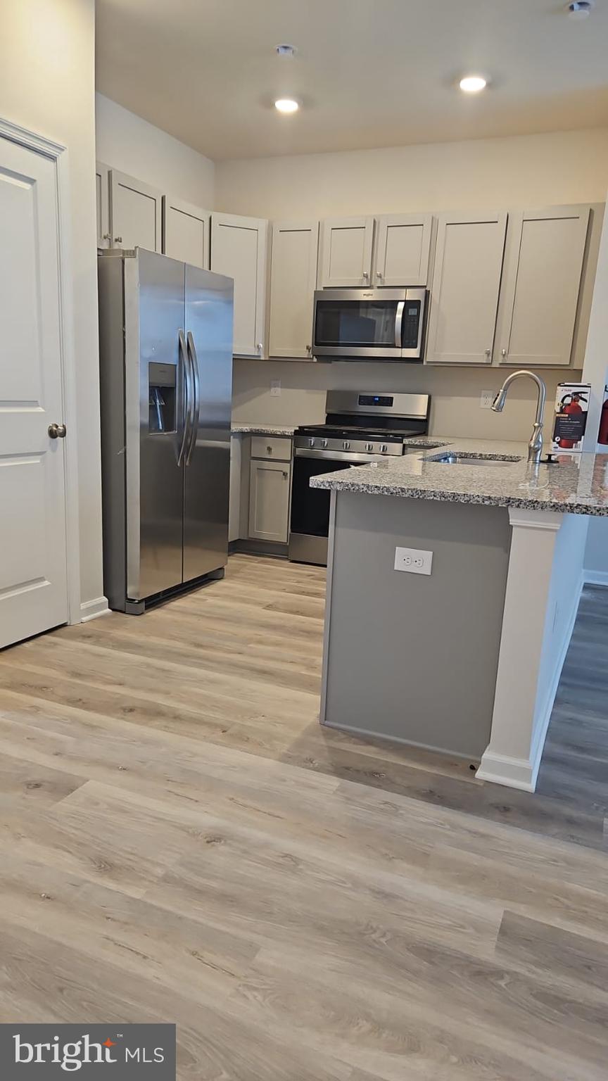 30 Elliot Lane Westampton, NJ 08060 - Photo 22 of 96 a kitchen with stainless steel appliances granite countertop a refrigerator and a stove top oven