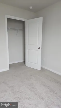 a white toilet sitting next to a shower