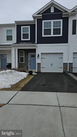 a front view of a house with yard