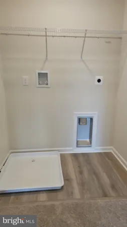 a bathroom with a sink a toilet and a large mirror