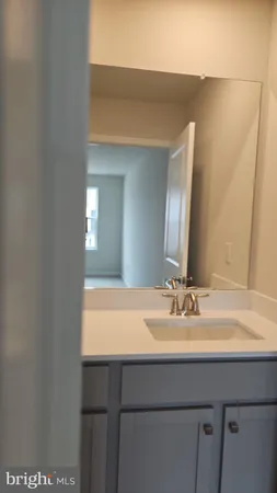 a view of a room with an empty space and a window