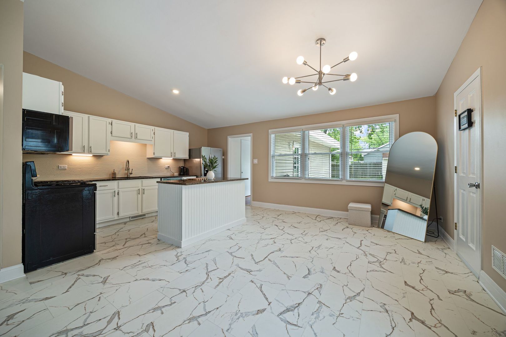 2117 Grouse Lane Rolling Meadows, IL 60008 - Photo 11 of 25 a kitchen with granite countertop a stove a sink and a refrigerator