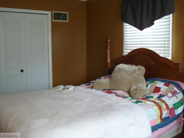 534 Wildlife Road Lexington, NC 27292 - Photo 10 of 16 2nd Bedroom. 2nd bedroom has huge walkin closet and french doors leading to an outside deck