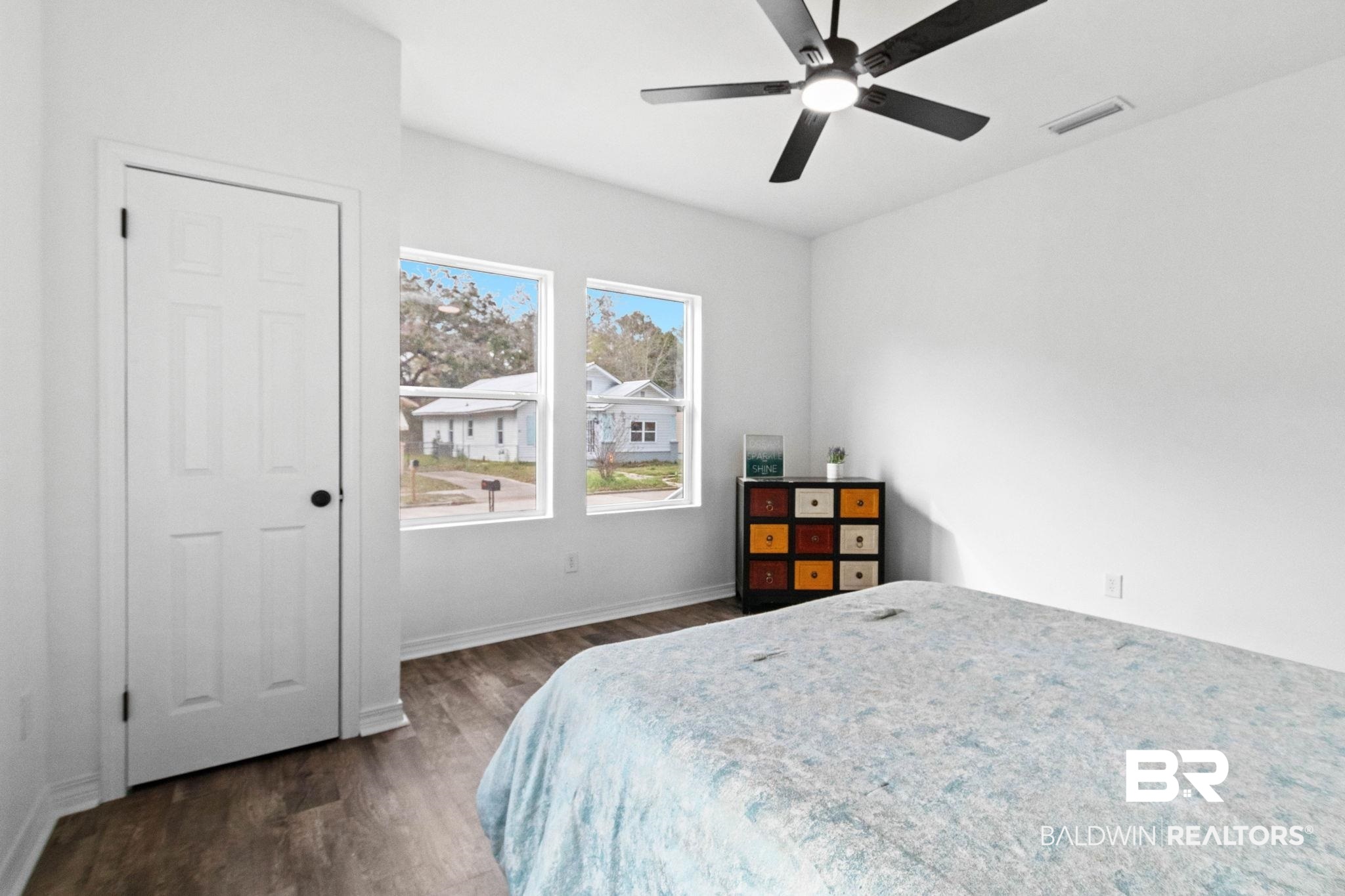 128 Bush Avenue Mobile, AL 36604 - Photo 31 of 40 Bedroom with ceiling fan and dark wood-type flooring