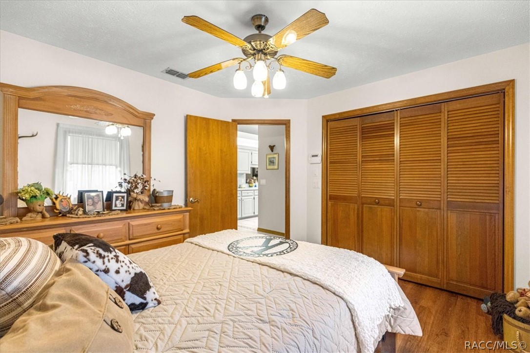 2964 South Cygnet Terrace Inverness, FL 34450 - Photo 31 of 67 a bedroom with a bed and a chandelier