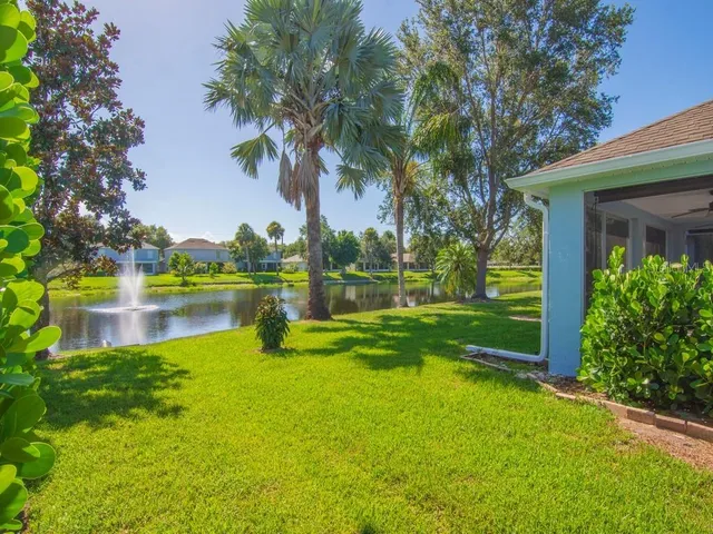 a view of a house with a yard porch and sitting area