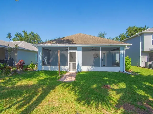 a view of a house with a yard porch and sitting area