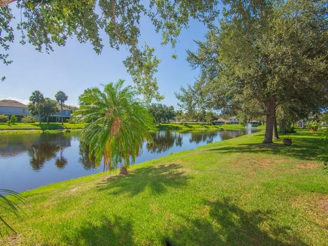 a view of a glass door and a yard from a balcony