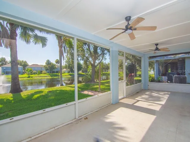 a view of a swimming pool with a yard