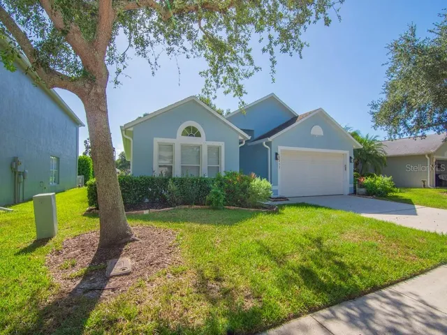 a view of a swimming pool with a patio