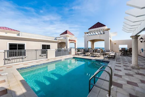 a view of a chairs and table in backyard