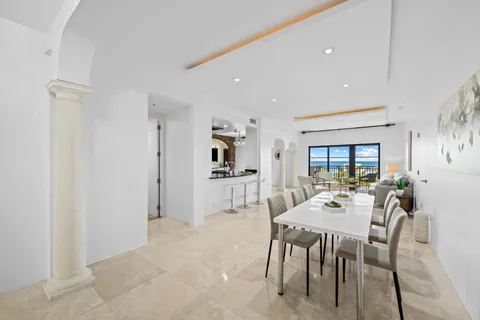 a view of a dining room with furniture and window
