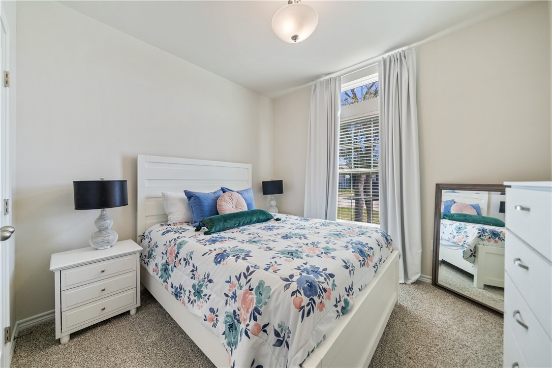 1906 Shellbank Avenue Aransas Pass, TX 78336 - Photo 20 of 27 a bedroom with a bed and a window