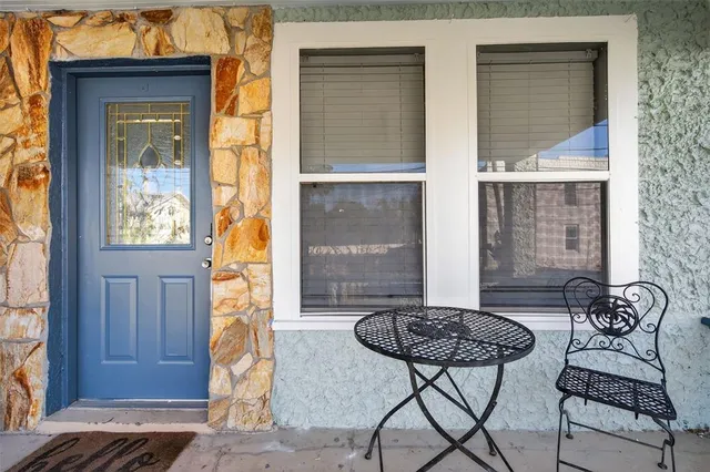 a bathroom with a tub and a window