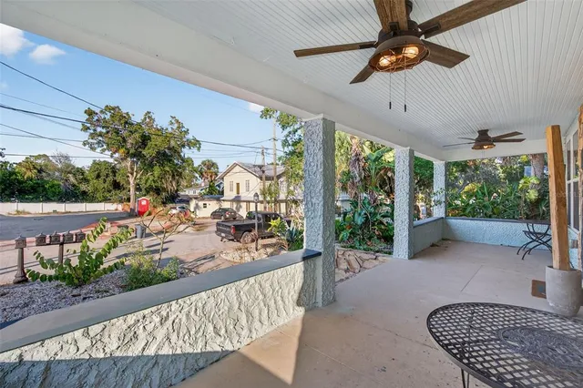 a bathroom with a granite countertop double vanity sink a mirror and a shower