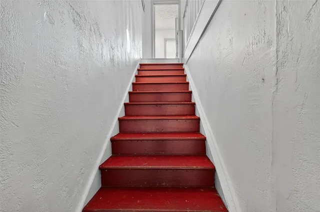a kitchen that has a sink and a stove