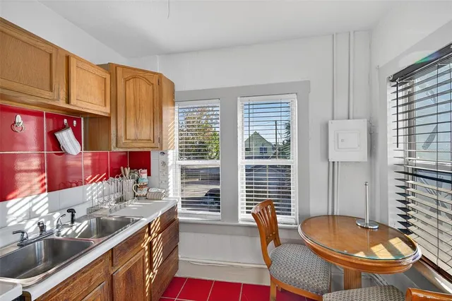a living room with furniture wooden floor and a window