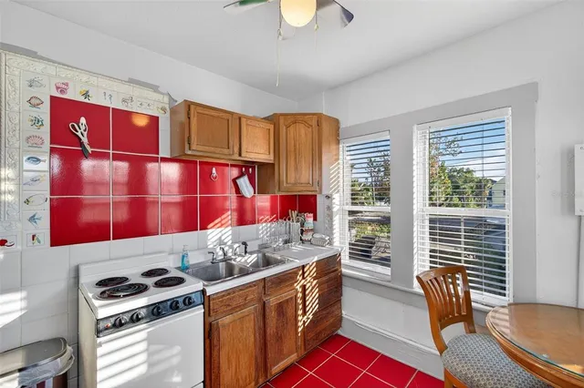 a spacious bedroom with a bed and a cabinets